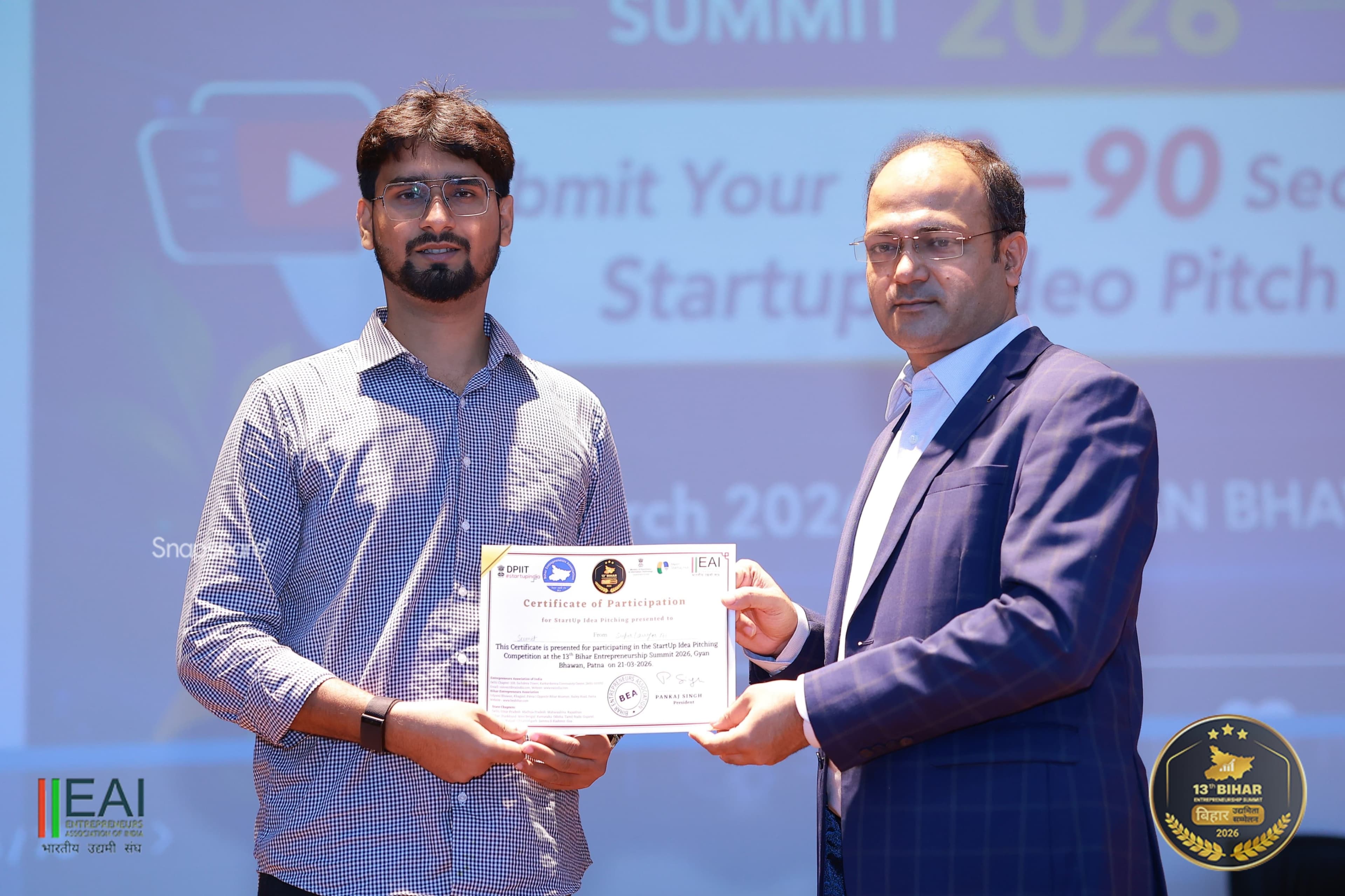 Sumit receiving a certificate on stage at the startup summit